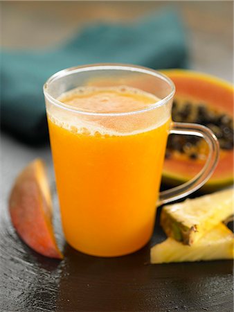 Papaya,pineapple and mango smoothie Stock Photo - Premium Royalty-Free, Code: 652-03803554