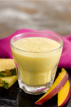 smoothie in cocktail glass - Banana,mango and pineapple milkshake Stock Photo - Premium Royalty-Free, Code: 652-03803581