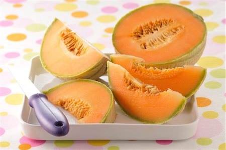 Sliced melon Foto de stock - Sin royalties Premium, Código: 652-03803676