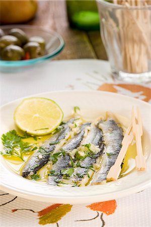 fish with olive oil - Anchovies with vinegar,garlic and parsley Stock Photo - Premium Royalty-Free, Code: 652-03803768