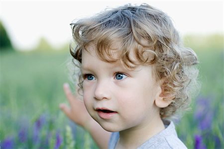 Boy With Blonde Curly Hair And Blue Eyes Stock Photos Page 1