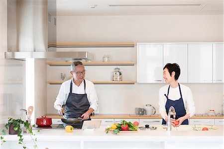 east asian cooking - Senior couple cooking Stock Photo - Premium Royalty-Free, Code: 669-09145726