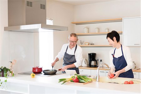 east asian cooking - Senior couple cooking Stock Photo - Premium Royalty-Free, Code: 669-09145730