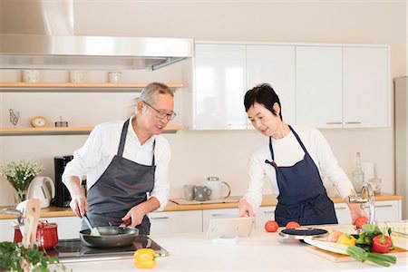 east asian cooking - Senior couple cooking Stock Photo - Premium Royalty-Free, Code: 669-09145731