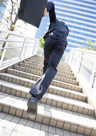 swift - Businessman running Stock Photo - Premium Royalty-Free, Code: 669-02309164