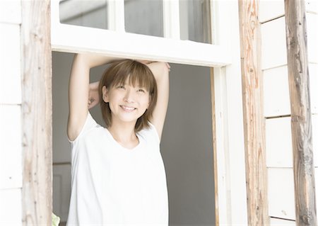feel - A woman by the window Stock Photo - Premium Royalty-Free, Code: 669-02642264