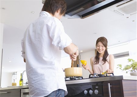 Couple cooking Stock Photo - Premium Royalty-Free, Code: 669-03708464