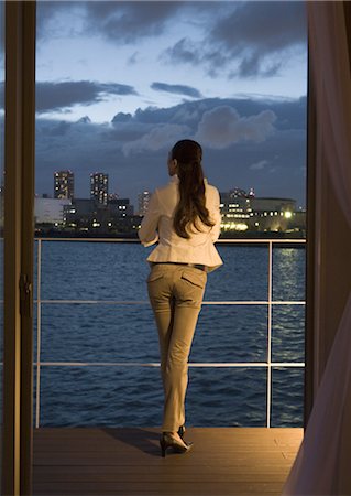 Woman enjoying night view Stock Photo - Premium Royalty-Free, Code: 669-03708617