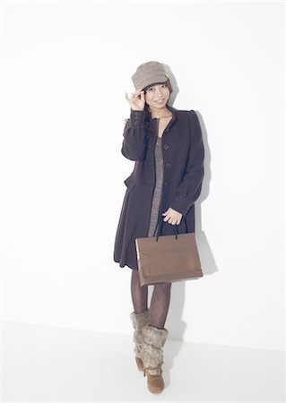 fur - Young woman holding paper bag Stock Photo - Premium Royalty-Free, Code: 669-03734111