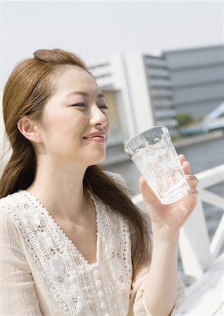 soft drinks - Young woman drinking glass of soda Stock Photo - Premium Royalty-Free, Code: 669-03884415