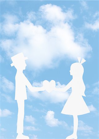 Blue sky and paper cutout of a couple facing each other Stock Photo - Premium Royalty-Free, Code: 670-05652475