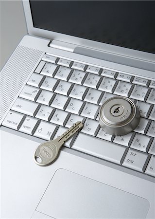 Computer keyboards with keyhole and key Stock Photo - Premium Royalty-Free, Code: 670-05652929