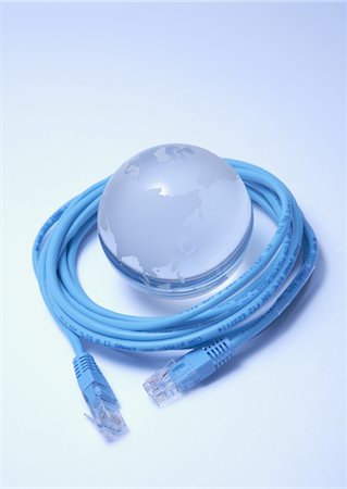 system - Glass globe surrounded with LAN cable Stock Photo - Premium Royalty-Free, Code: 670-05854849