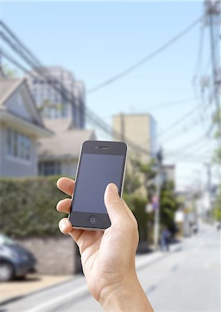 Residential area and a smartphone Stock Photo - Premium Royalty-Free, Code: 670-06450427
