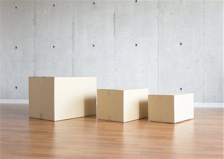 Concrete wall and cardboard boxes Foto de stock - Sin royalties Premium, Código: 670-06450618