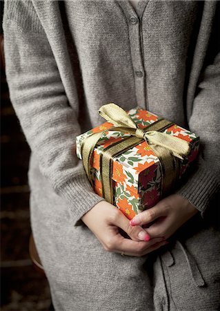 Woman holding a gift box Stock Photo - Premium Royalty-Free, Code: 670-06450747