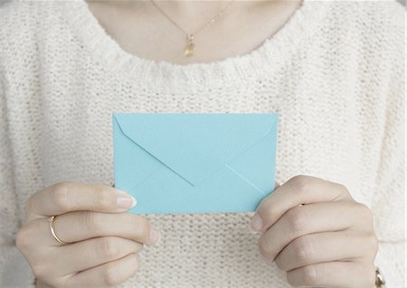envelope (package) - Hands holding an envelope Stock Photo - Premium Royalty-Free, Code: 670-06450908