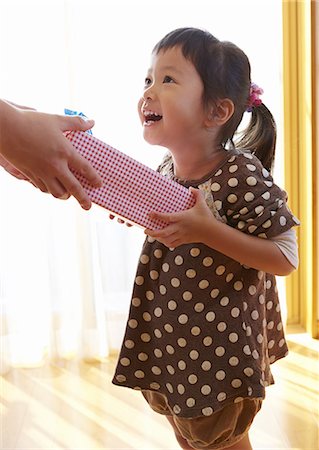 Girl getting a gift Stock Photo - Premium Royalty-Free, Code: 670-06824787