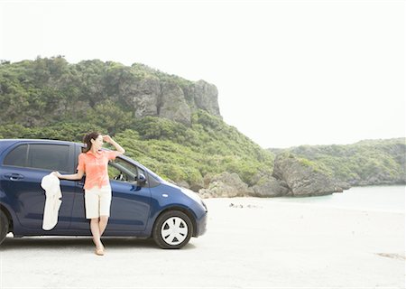 A young woman with a car Stock Photo - Premium Royalty-Free, Code: 670-02310255