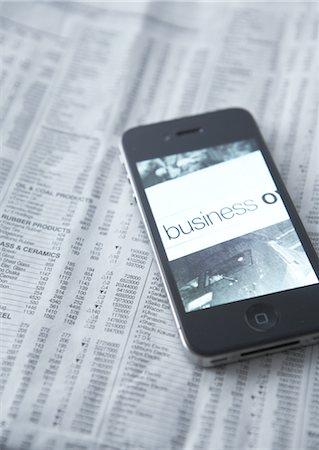 stock exchange - Smartphone and newspaper Stock Photo - Premium Royalty-Free, Code: 670-03709152