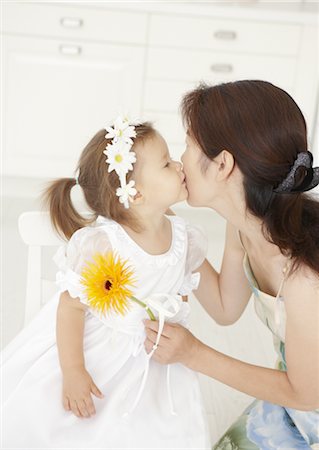 Girl kissing her mother Stock Photo - Premium Royalty-Free, Code: 670-03709912