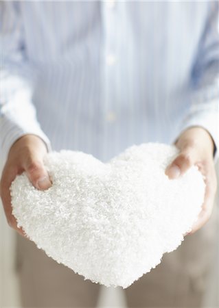 Heart shaped cushion Stock Photo - Premium Royalty-Free, Code: 670-03709984