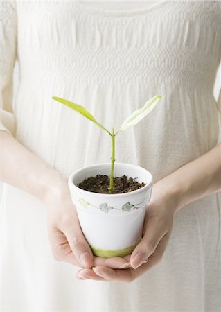 ecology - Pregnant woman holding potted plant Stock Photo - Premium Royalty-Free, Code: 670-03885940