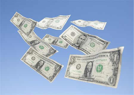 drifting - Dollar bills wafting in blue sky Stock Photo - Premium Royalty-Free, Code: 670-03886183