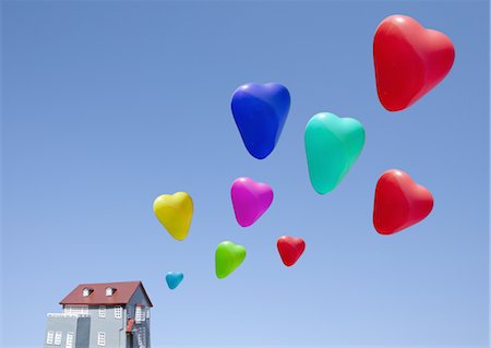 Ballons et maison miniature en forme de coeur Photographie de stock - Premium Libres de Droits, Code: 670-03886200