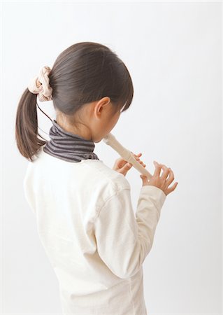 recorder - Girl playing recorder Stock Photo - Premium Royalty-Free, Code: 670-03886268