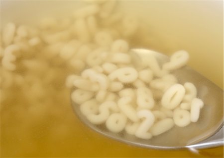 Number shaped macaroni in soup Stock Photo - Premium Royalty-Free, Code: 670-03886409