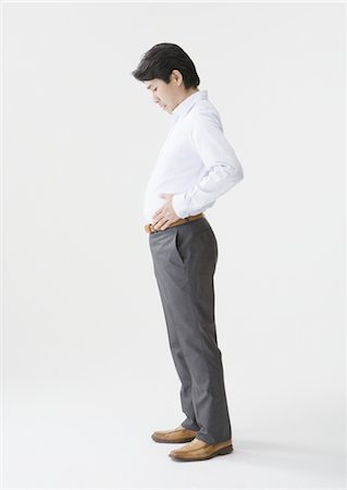 pantalón - Man worried about his belly Foto de stock - Sin royalties Premium, Código: 670-03886776