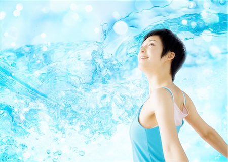 Young woman smiling Stock Photo - Premium Royalty-Free, Code: 670-03887080