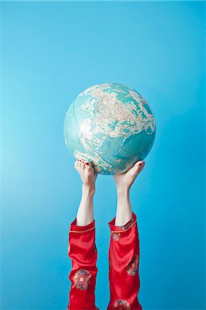 people holding globe - Feet holding globe Stock Photo - Premium Royalty-Free, Code: 673-06025418