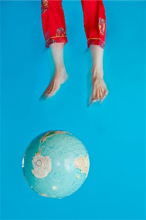 Globe and feet in air Stock Photo - Premium Royalty-Free, Code: 673-06025420