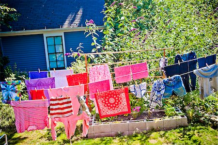 dry off - Colorful laundry hanging on outdoor lines Stock Photo - Premium Royalty-Free, Code: 673-06025442