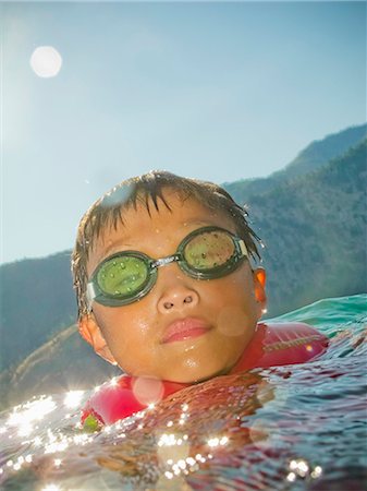 Boy coming up out of water Stock Photo - Premium Royalty-Free, Code: 673-06025468