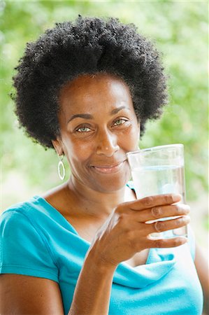 eight - Woman drinking glass of water Stock Photo - Premium Royalty-Free, Code: 673-06964564