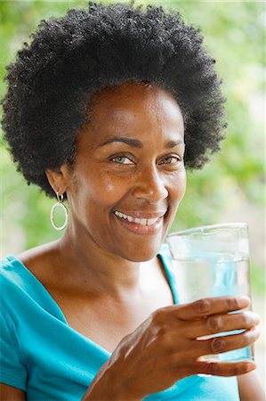 Woman drinking glass of water Stock Photo - Premium Royalty-Free, Code: 673-06964563