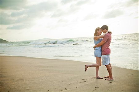 foot print - Romantic young couple on beach Stock Photo - Premium Royalty-Free, Code: 673-06964775