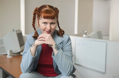 Portrait of a young, red-haired businesswoman. Stock Photo - Premium Royalty-Free, Code: 673-02137572
