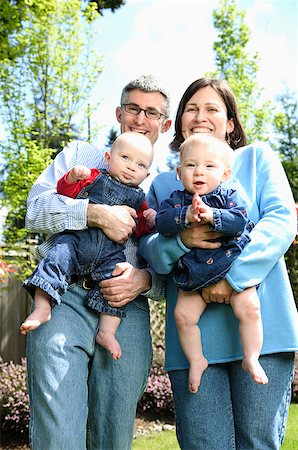 foursome - A mother and father with twin babies. Stock Photo - Premium Royalty-Free, Code: 673-02137603