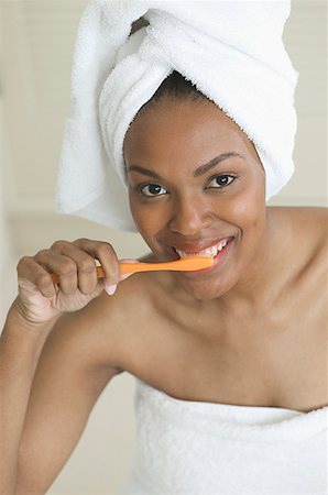 A woman brushing her teeth. Stock Photo - Premium Royalty-Free, Code: 673-02137677