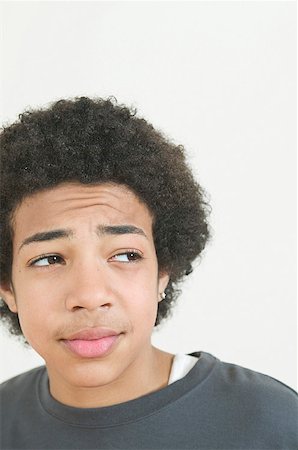 passoire - Cropped portrait of a teenage boy looking to the side. Stock Photo - Premium Royalty-Free, Code: 673-02137769