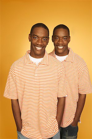 Twin teen boys in matching shirts. Stock Photo - Premium Royalty-Free, Code: 673-02137877
