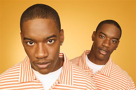 passoire - Twin teenage boys in matching shirts. Stock Photo - Premium Royalty-Free, Code: 673-02137881