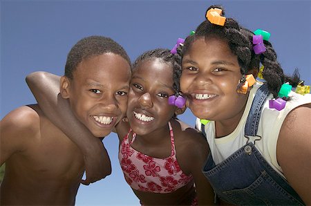 pictures of brothers and sisters black kids - Portrait of three children with their heads together. Stock Photo - Premium Royalty-Free, Code: 673-02137919
