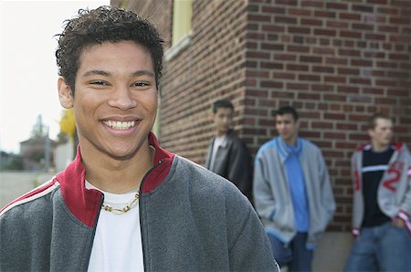 Smiling teenage boy and his pals. Stock Photo - Premium Royalty-Free, Code: 673-02137991