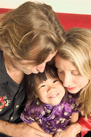 Portrait of parents with their daughter. Stock Photo - Premium Royalty-Free, Code: 673-02138056