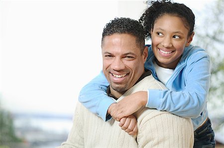 Teenage girl gives her father a hug. Stock Photo - Premium Royalty-Free, Code: 673-02138066